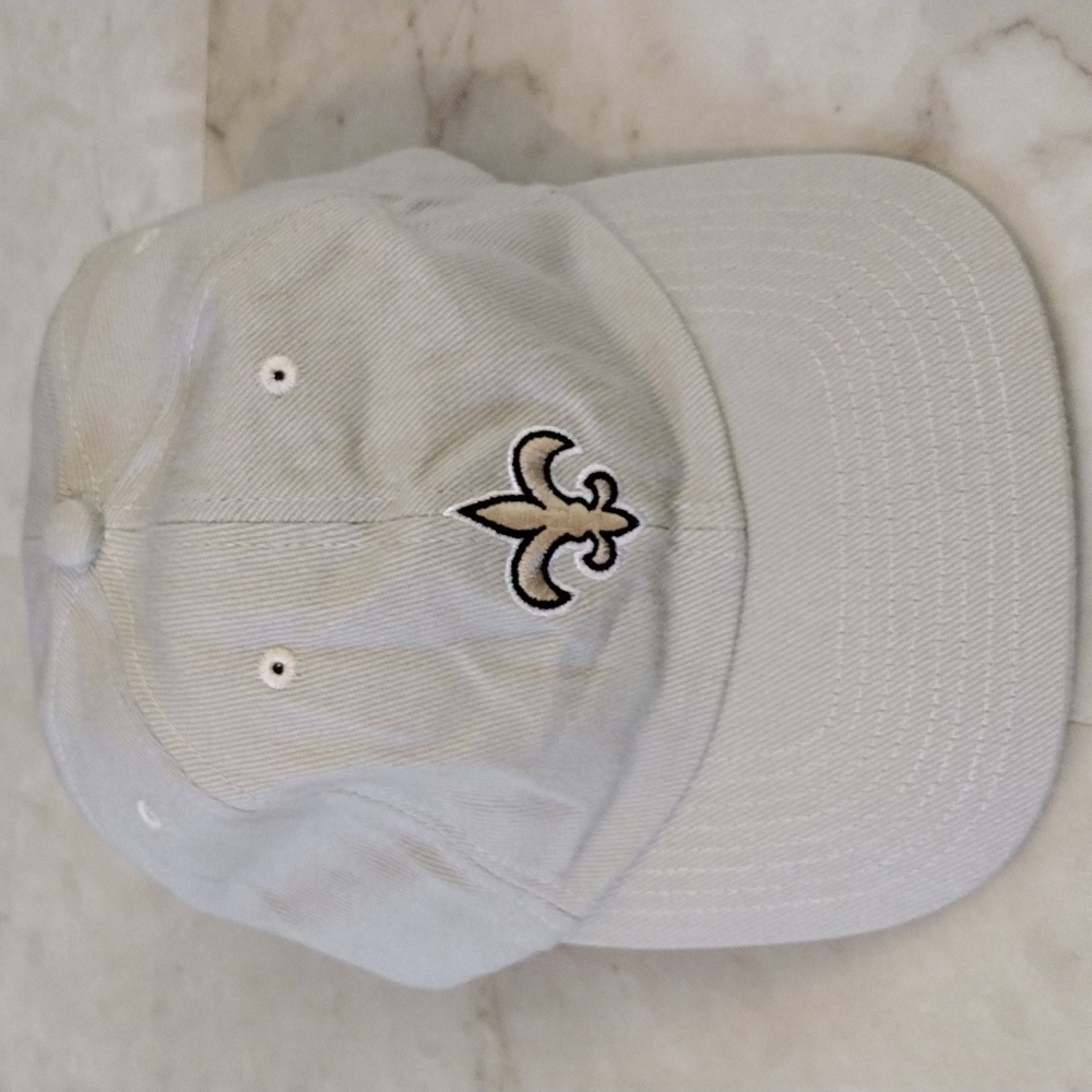 NFL Saints baseball cap.